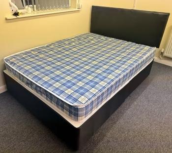 4 Foot Economy Mattress with black divan base and headboard