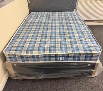 King size Economy Mattress with black divan base and headboa